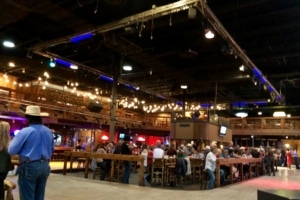 Patrons sit at the bar in The Stampede