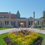 The Greek Theater and Colonnade of Civic Benefactors pictured with a large patch of flowers