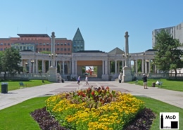 The Greek Theater and Colonnade of Civic Benefactors pictured with a large patch of flowers