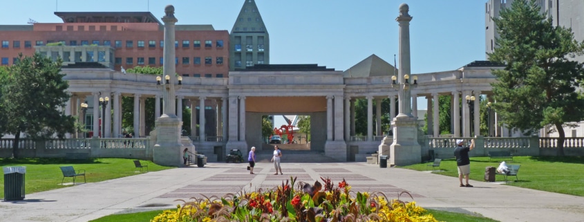 The Greek Theater and Colonnade of Civic Benefactors pictured with a large patch of flowers