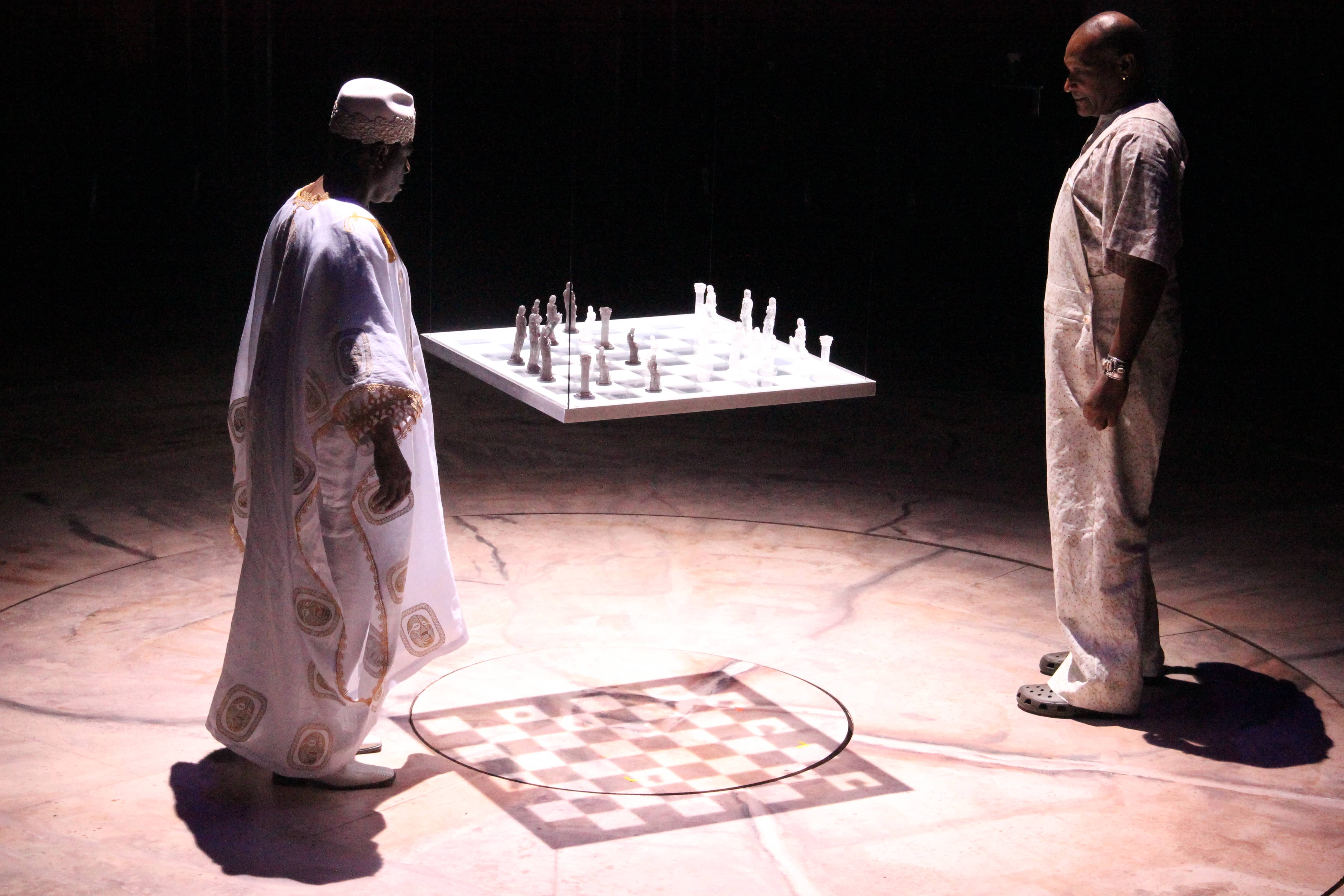 Two men observe a floating white chess board in black odyssey