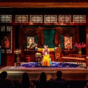 The cast of The Chinese Lady performs on an opulent stage