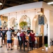 A light and airy bar filled with people