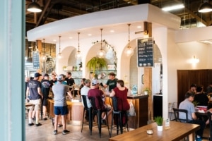 A light and airy bar filled with people