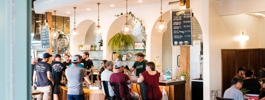 A light and airy bar filled with people