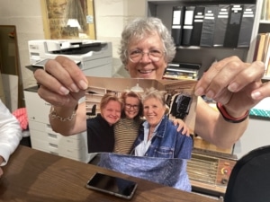 Sheila Morris holds up a photograph of Cathie Gagnon