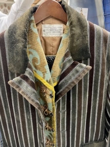 A close up shot of the lapels of a striped suit in Sweeney Todd