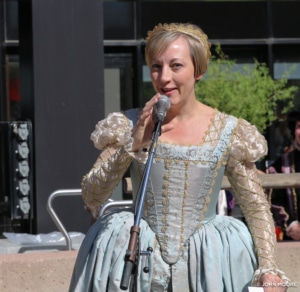 DCPA President and CEO Janice Sinden wearing a blue Elizabethan style gown