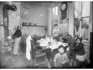 An old photograph of a family seated in their home in Denver's Chinatown