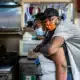 A man hugs a woman from behind in the Welton Street Cafe
