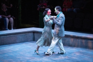 A couple dances together in Much Ado About Nothing