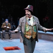 A man gestures onstage in Much Ado About Nothing