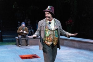 A man gestures onstage in Much Ado About Nothing