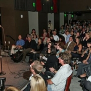 A comedian stands onstage at Comedy Works