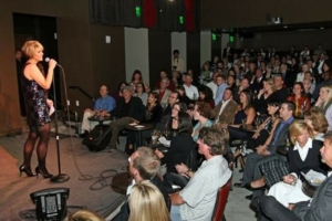 A comedian stands onstage at Comedy Works