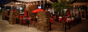 A restaurant patio with string lights