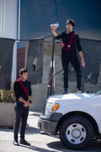 Two actors perform in Shakespeare in the Parking Lot