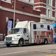 A large semi truck called the Bookmobile outside the DCPA