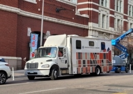 A large semi truck called the Bookmobile outside the DCPA