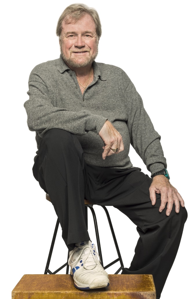 Chip Davis seated on a stool