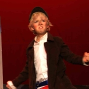 A young Erik Peterson as Gavroche in Les Mis