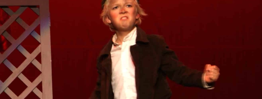 A young Erik Peterson as Gavroche in Les Mis