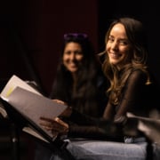 Jamie Ann Romero smiles onstage during Cebollas rehearsal