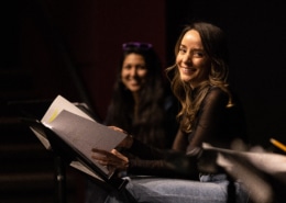 Jamie Ann Romero smiles onstage during Cebollas rehearsal