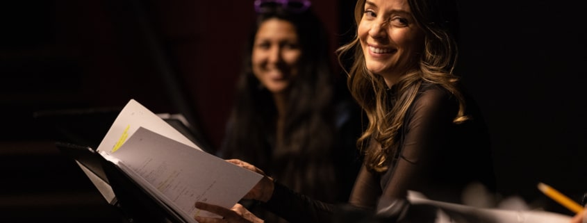 Jamie Ann Romero smiles onstage during Cebollas rehearsal