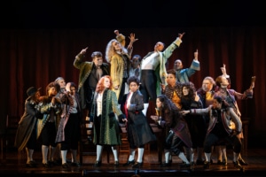 The cast of 1776 poses dramatically onstage