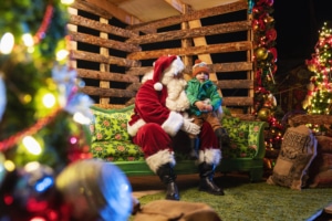 A child sits on Santa's lap at Camp Christmas