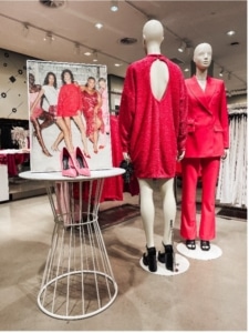 Two mannequins wearing red in H&M