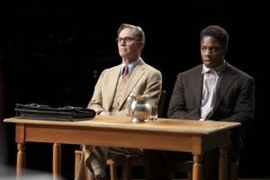 Atticus Finch sits next to Tom Robinson in court in To Kill a Mockingbird