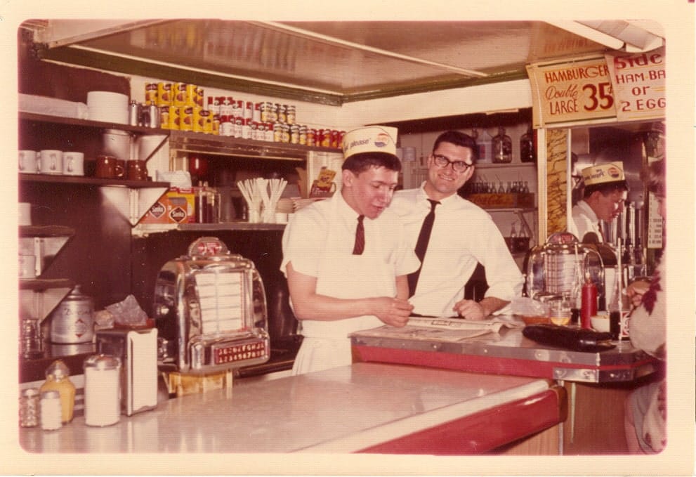 An old photograph of two workers at Sam's No. 3