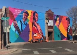 A colorful mural in the Five Points Plaza