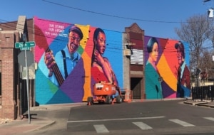 A colorful mural in the Five Points Plaza