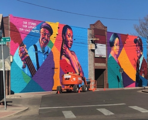 A colorful mural in the Five Points Plaza