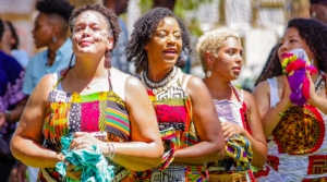 Women wearing traditional African garments stand together during the Colorado Black Arts Festival