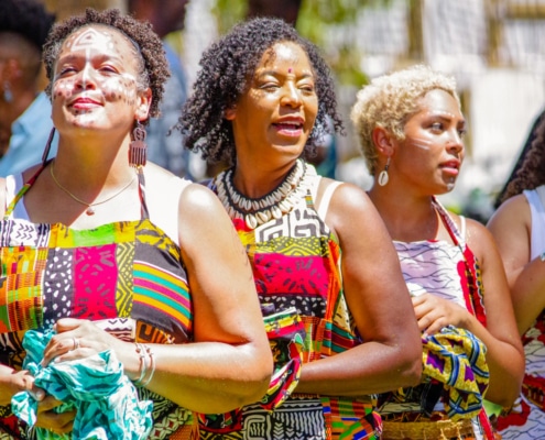 Women wearing traditional African garments stand together during the Colorado Black Arts Festival