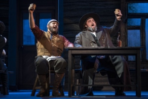 Tevye and Lazar Wolf raise their glasses in Fiddler on the Roof