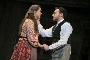 Tzeitel and Motel embrace in Fiddler on the Roof