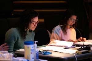 Playwright Jake Brasch and director Shelley Butler are seated at a table during rehearsal for the reservoir