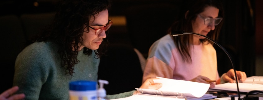 Playwright Jake Brasch and director Shelley Butler are seated at a table during rehearsal for the reservoir