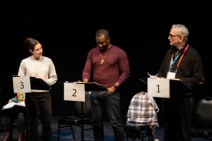 Stephanie Machado, Andy Lucien, and Rocco Sisto stand at their music stands to rehearse Joan Dark