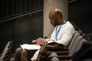 Playwright Vincent Terrell Durham sits in the audience while reviewing the script for Polar Bears, Black Boys & Prairie Fringed Orchids