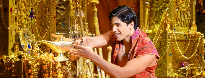 Aladdin reaches for the magic lamp in the underground treasure trove, the Cave of Wonders