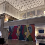 The colorful 1776 mural on display in the Renaissance Hotel lobby