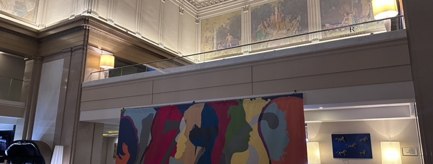 The colorful 1776 mural on display in the Renaissance Hotel lobby