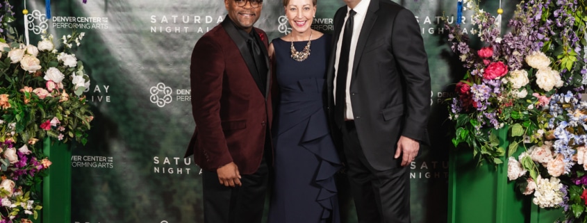 Denver Mayor Michael Hancock, DCPA President and CEO Janice Sinden, and DCPA Board Chair Hassan Salem pose for a photo at Saturday Night Alive