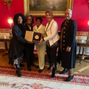 The five founders of IABD pose with their medal of the arts in the White House